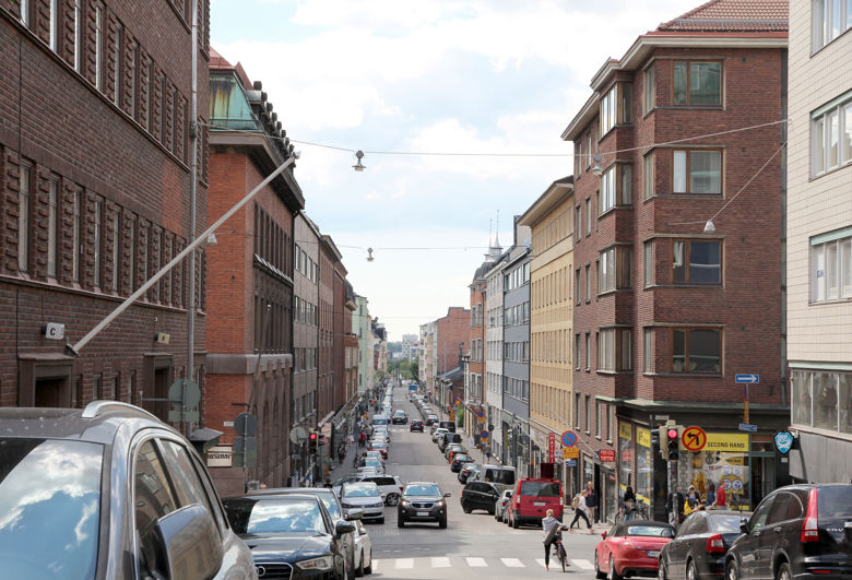 Kalevankatu in Helsinki. Narrow street with blocks of flats on both sides.